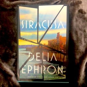 Siracusa by Delia Ephron.  Hard cover book. Drone Reese Witherspoon’s book club